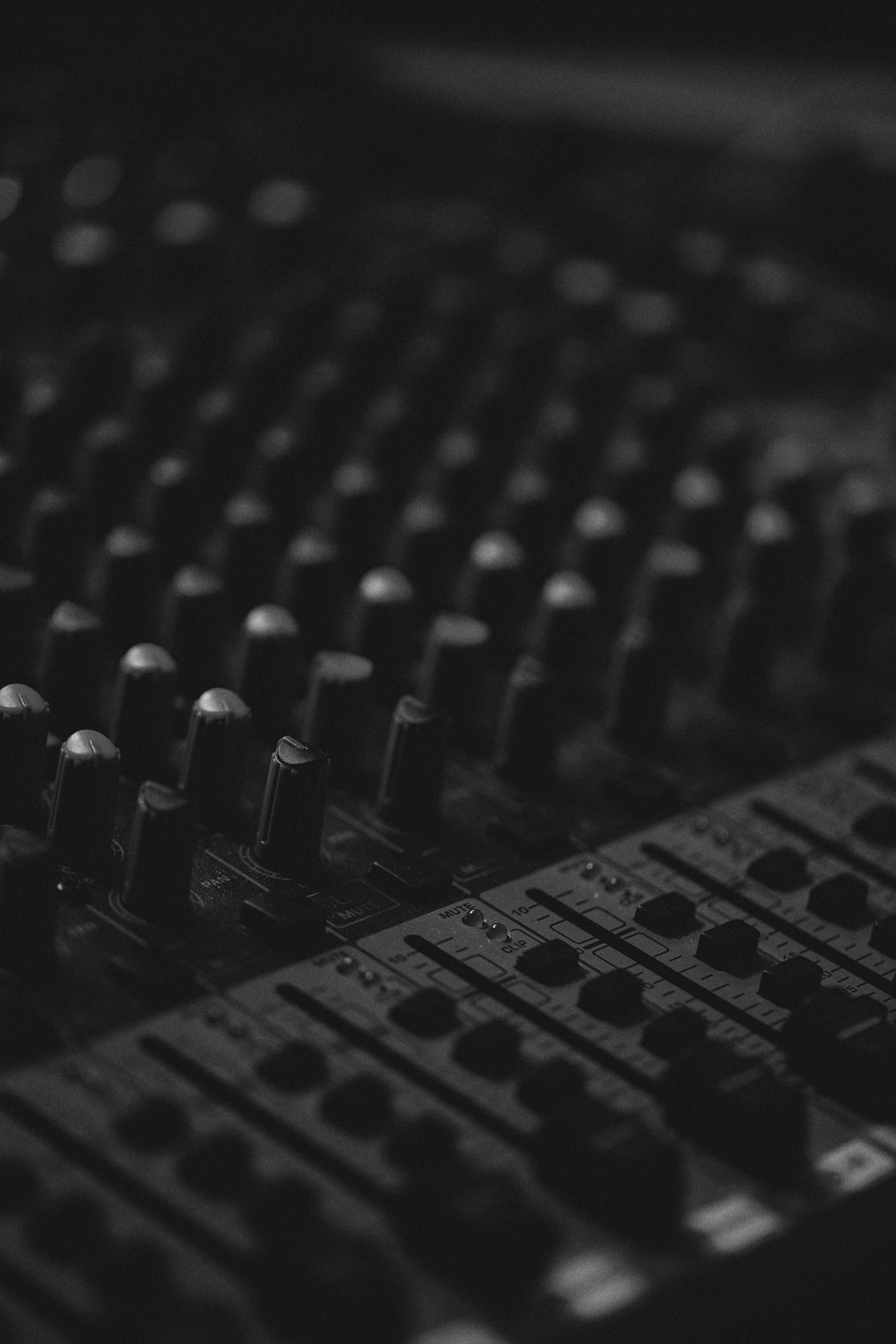 Close up photo of an audio mixing board. Photo by Joonas Sild.